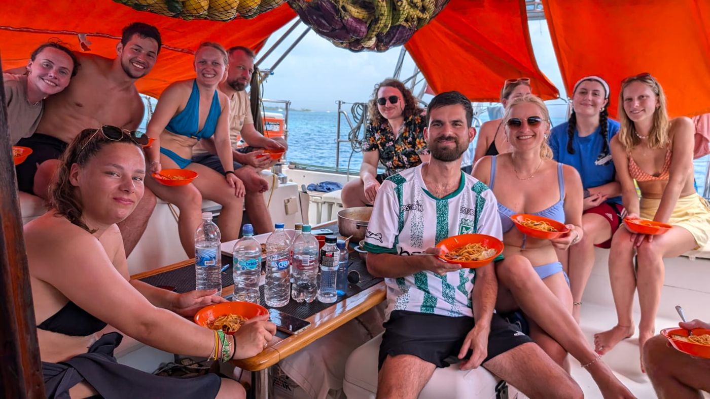 Guests sharing dinner at the table on board